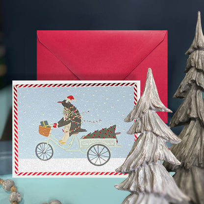 Penguin Riding in Snow Christmas Card
